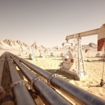 Oil,Pump,Jack,Rocking,With,Pipeline,In,The,Background.