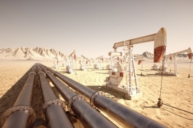 Oil,Pump,Jack,Rocking,With,Pipeline,In,The,Background.